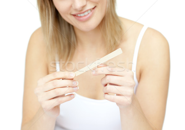 Portrait of a smiling woman filing her nails Stock photo © wavebreak_media