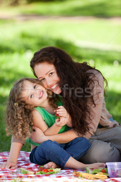 Stock photo: Mother and her daughter picnicking