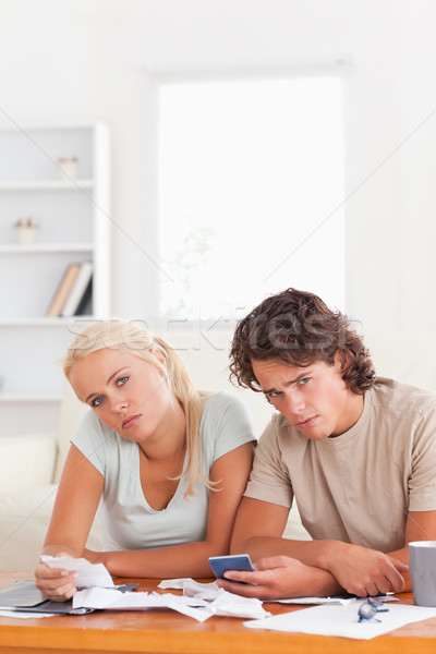 Cansado Pareja mirando cámara salón casa Foto stock © wavebreak_media