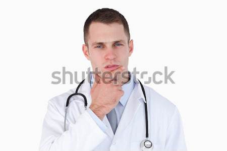 Close up of doctor thinking on white background Stock photo © wavebreak_media