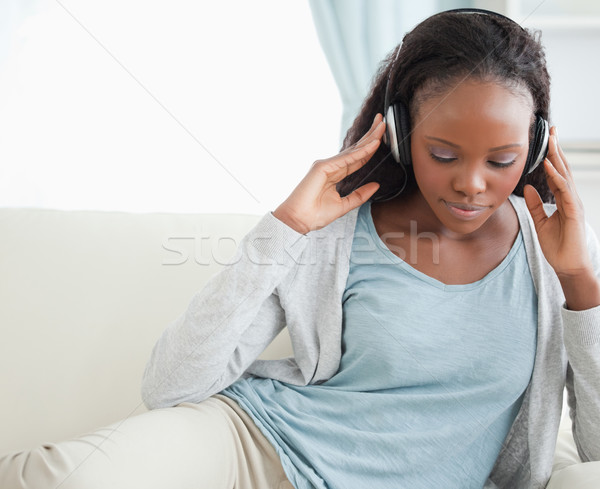 Close up of young woman listening to music Stock photo © wavebreak_media