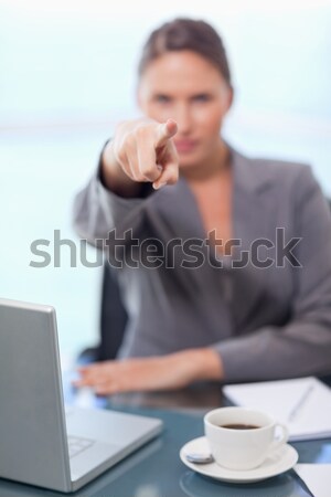 Portrait of a young businesswoman refusing a conversation in her office Stock photo © wavebreak_media