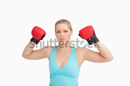 Woman rising her gloves against white background Stock photo © wavebreak_media