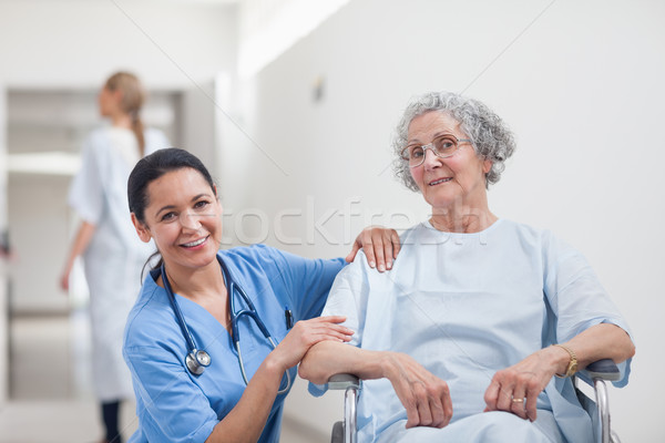 Nurse and patient smiling in hospital ward Stock photo © wavebreak_media