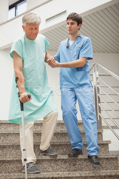 Male nurse assisting a patient Stock photo © wavebreak_media