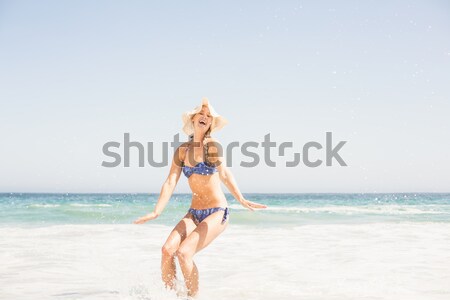 Happy fit woman in bikini running from the sea Stock photo © wavebreak_media