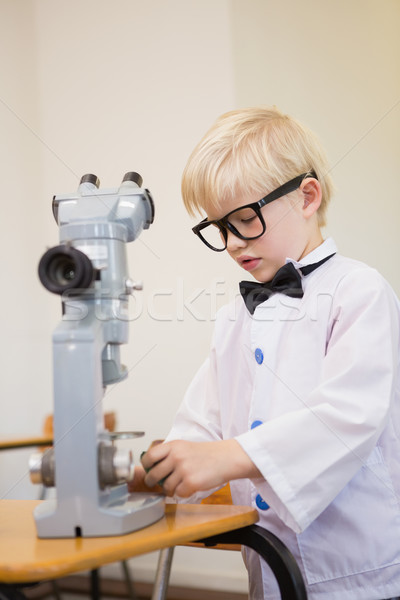 Cute pupil dressed up as scientist in classroom Stock photo © wavebreak_media