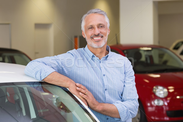 Smiling customer leaning on car Stock photo © wavebreak_media