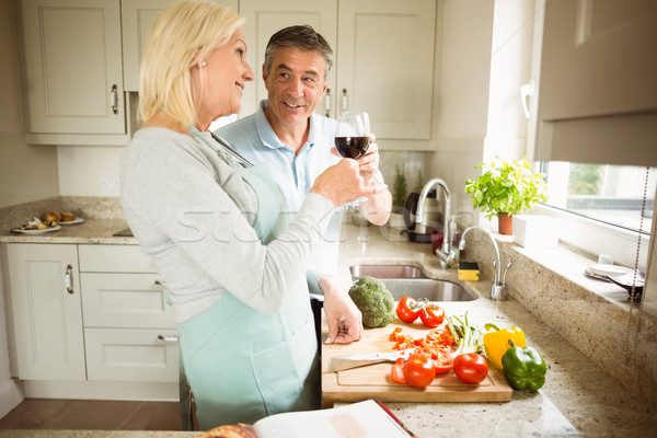 Stock photo: Mature couple preparing vegetables together
