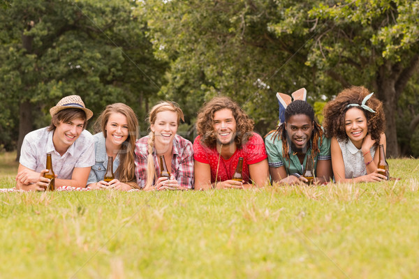 Happy friends in the park having picnic Stock photo © wavebreak_media