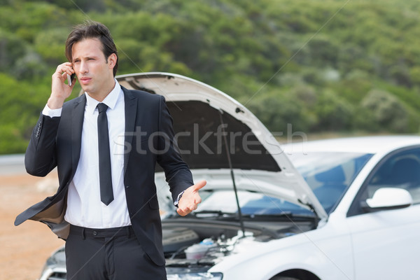 Businessman after a car breakdown Stock photo © wavebreak_media