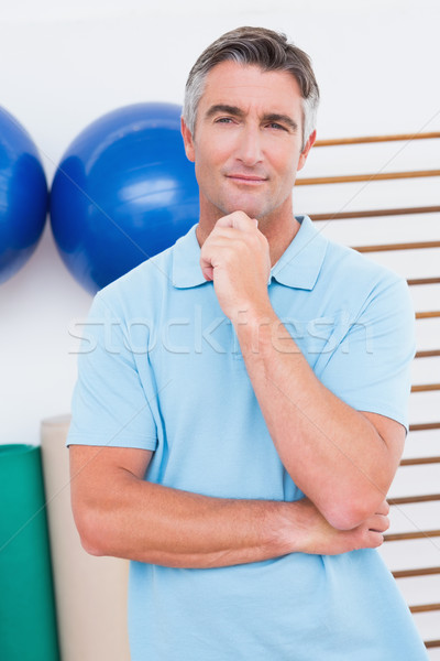 Thoughtful man posing with hand on chin Stock photo © wavebreak_media