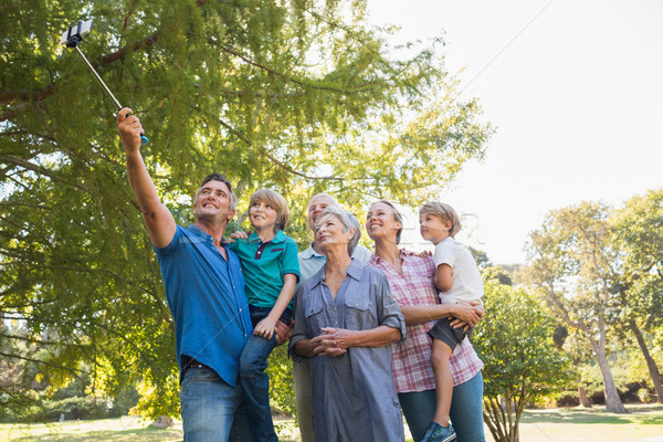 Famiglia felice stick parco albero primavera Foto d'archivio © wavebreak_media