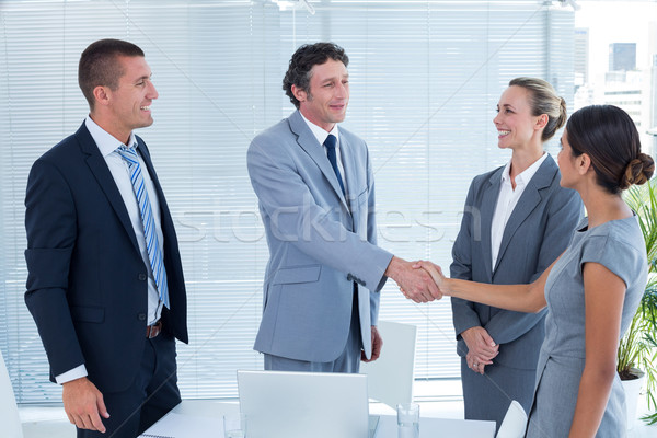 Stock photo: Business colleagues shaking hands