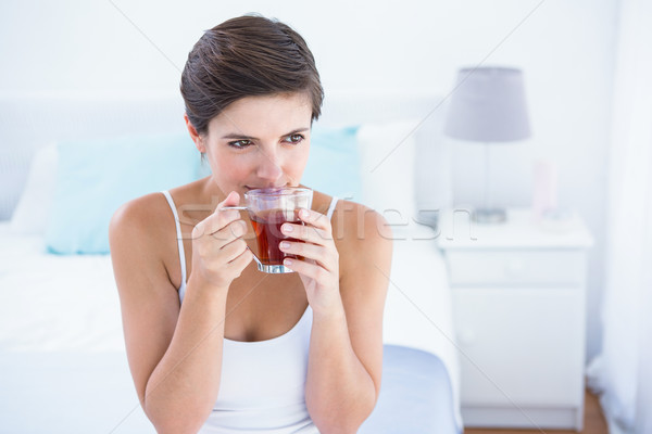 Stock photo: Thoughtful  woman drinking cup of tea 