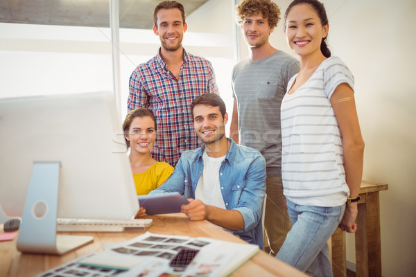 Creative équipe commerciale souriant caméra portrait ordinateur [[stock_photo]] © wavebreak_media