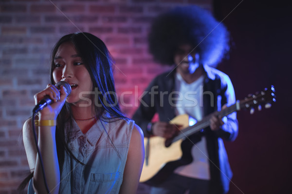 Beautiful singer with guitarist performing in nightclub Stock photo © wavebreak_media