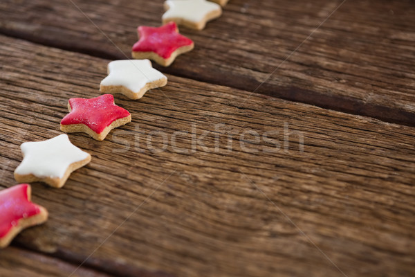 Red and white sugar cookies arranged on wooden table Stock photo © wavebreak_media