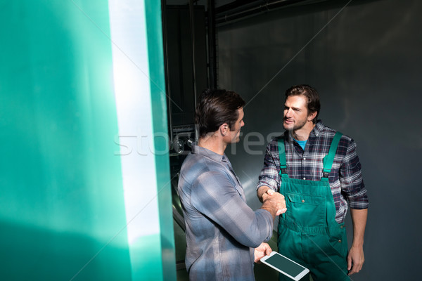 Coworkers discussing over digital tablet Stock photo © wavebreak_media