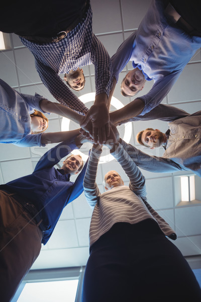 Directly below shot of business colleagues stacking hands at office Stock photo © wavebreak_media