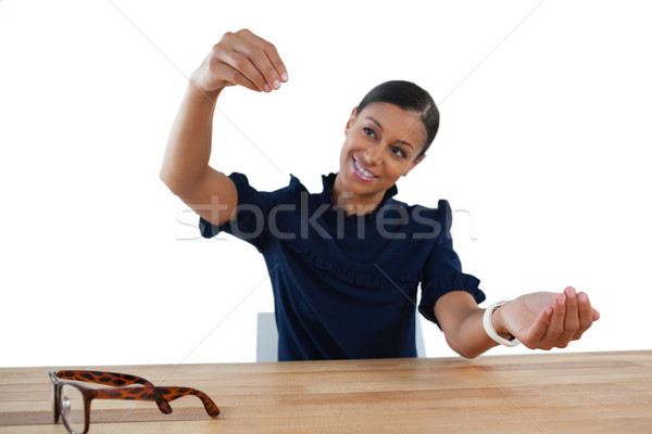 Businesswoman pretending to work on an invisible object Stock photo © wavebreak_media