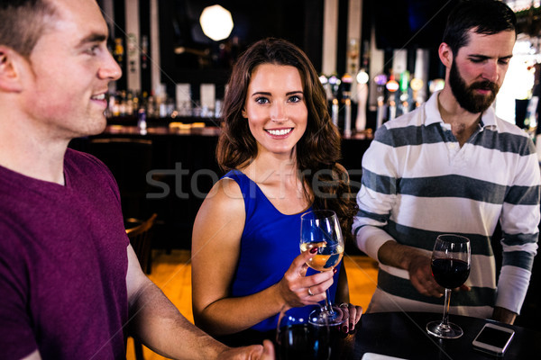 Friends having a glass of wine Stock photo © wavebreak_media