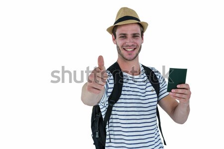 Smiling handsome man holding a leather wallet and showing thumbs Stock photo © wavebreak_media