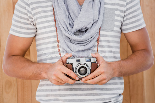 Man standing with a camera Stock photo © wavebreak_media