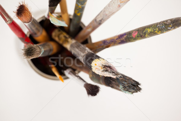 Varieties of paint brushes in metallic jar Stock photo © wavebreak_media