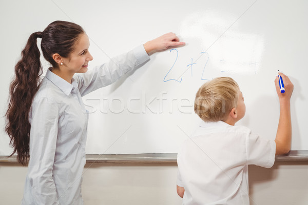 Teacher helping a student in class Stock photo © wavebreak_media