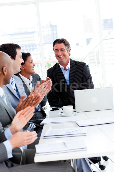 Stock photo: Team of successful business team applauding in a conference
