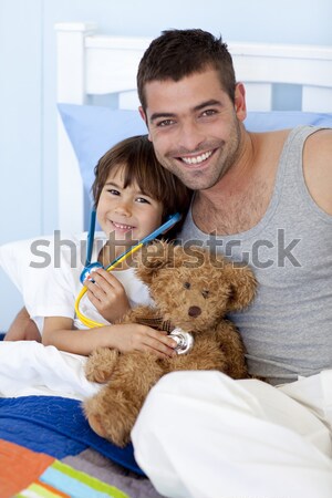 Stock photo: Smiling little boy attending a medical check-up