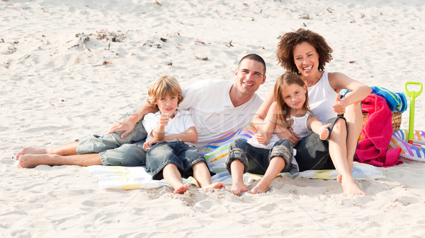 Family playing sitting on a beach Stock photo © wavebreak_media