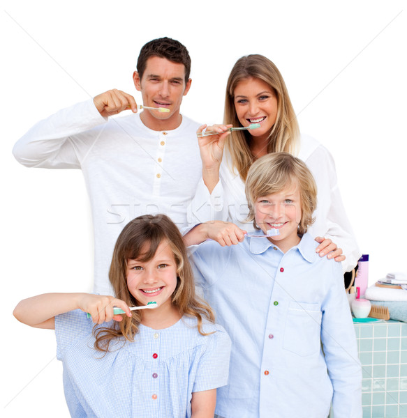 Smiling young family brushing their teeths Stock photo © wavebreak_media