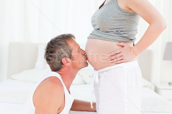 Homme baiser ventre maison sourire heureux [[stock_photo]] © wavebreak_media