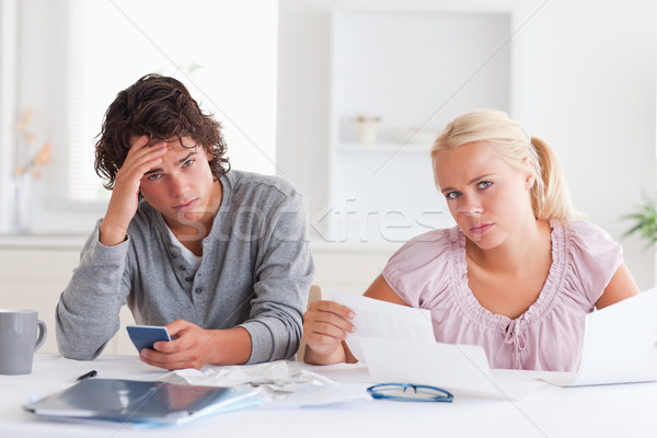 Despaired couple there accountsn their living room Stock photo © wavebreak_media