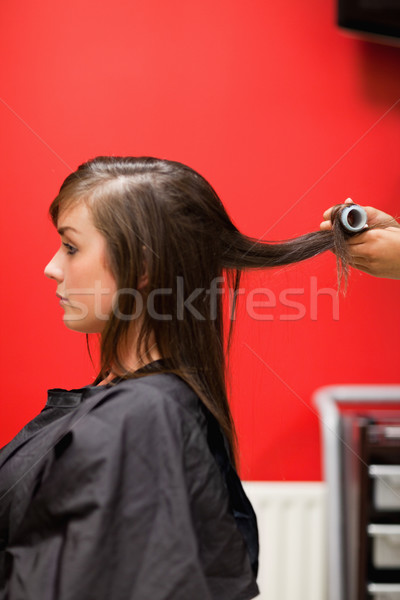 Portrait of hands rolling hair with a curler Stock photo © wavebreak_media