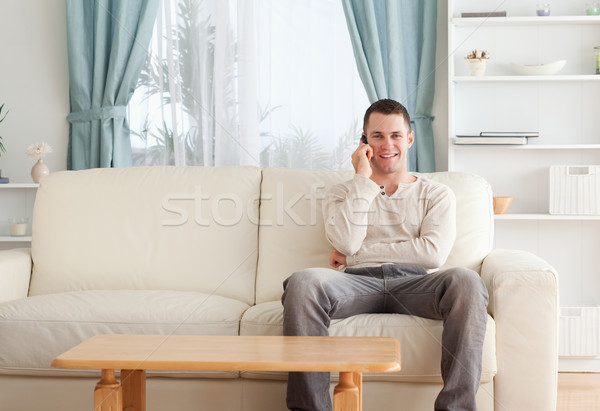 [[stock_photo]]: Homme · téléphone · séance · canapé · homme · blanc · blanche