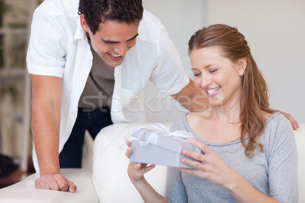 Young woman happy about the present she got from her boyfriend Stock photo © wavebreak_media