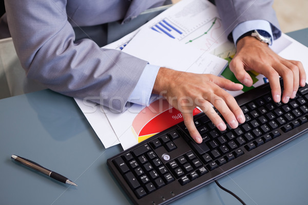 Young businessman's hands typing on keyboard Stock photo © wavebreak_media