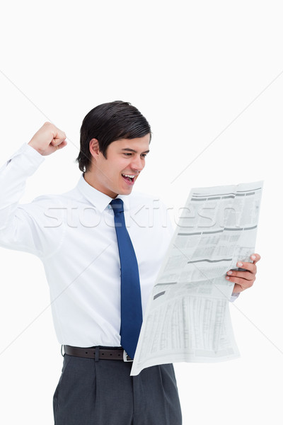 Celebrating tradesman looking at the news against a white background Stock photo © wavebreak_media