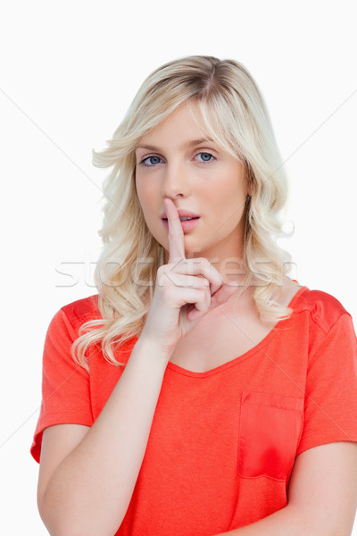 Fair-haired woman making a hand sign as an indication to shut up Stock photo © wavebreak_media