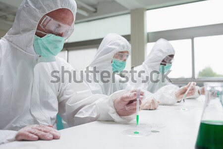 Surgeon touching at patient belly in an operating theatre Stock photo © wavebreak_media