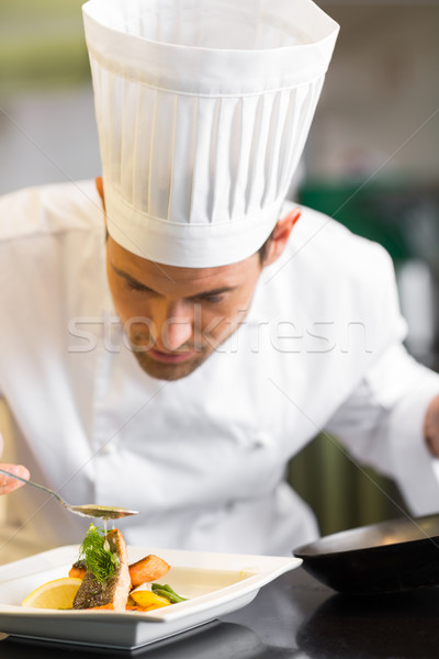 Closeup of a concentrated male chef garnishing food Stock photo © wavebreak_media