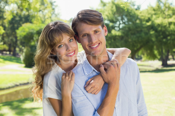 [[stock_photo]]: Cute · couple · souriant · caméra · ensemble · parc