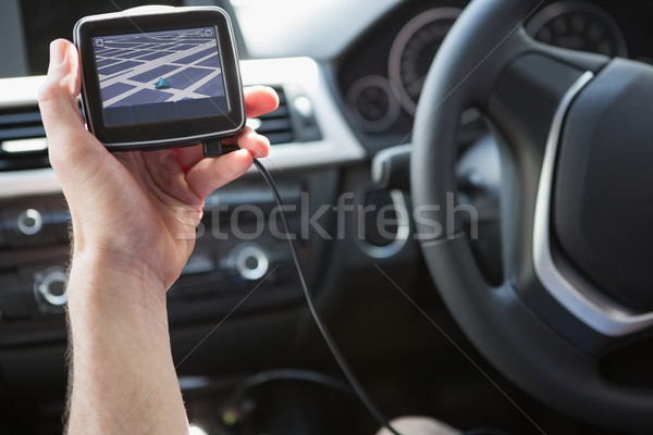 Stock photo: Man using satellite navigation system