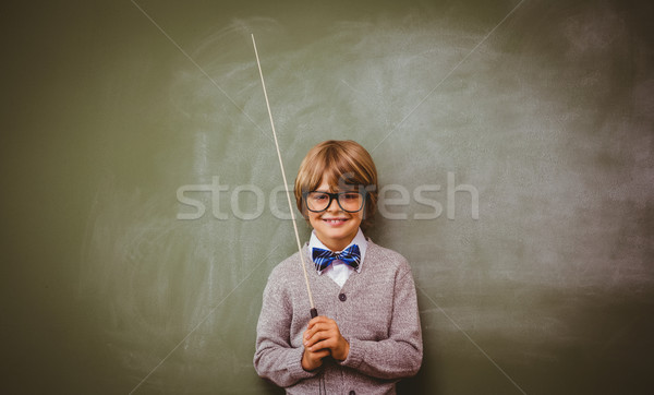 Portrait of cute little boy holding stick Stock photo © wavebreak_media