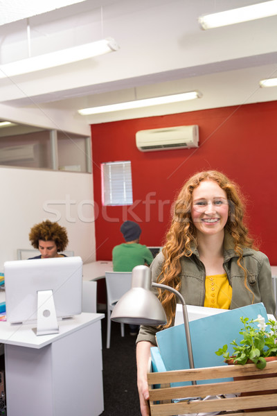 Casual businesswoman carrying her belongings in box Stock photo © wavebreak_media