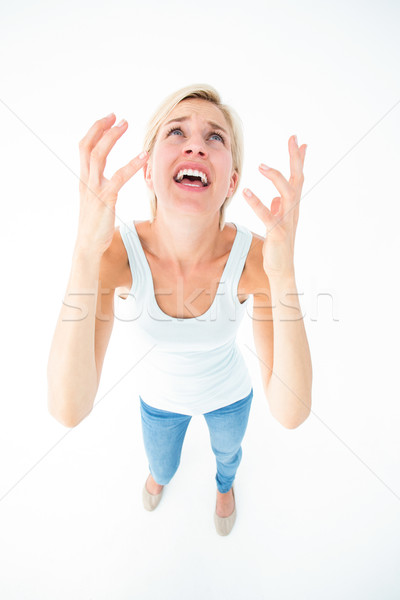 Stock photo: Upset woman yelling with hands up 