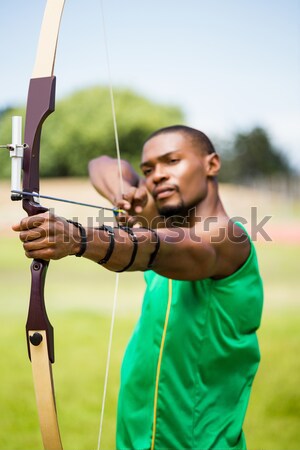 Composite image of close up view of man practicing archery  Stock photo © wavebreak_media
